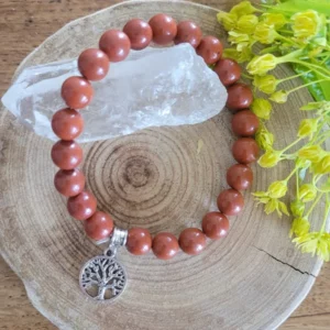bracelet artisanal en jaspe rouge pour l'ancrage avec pendentif arbre de vie en acier. sur rondelle de bois.